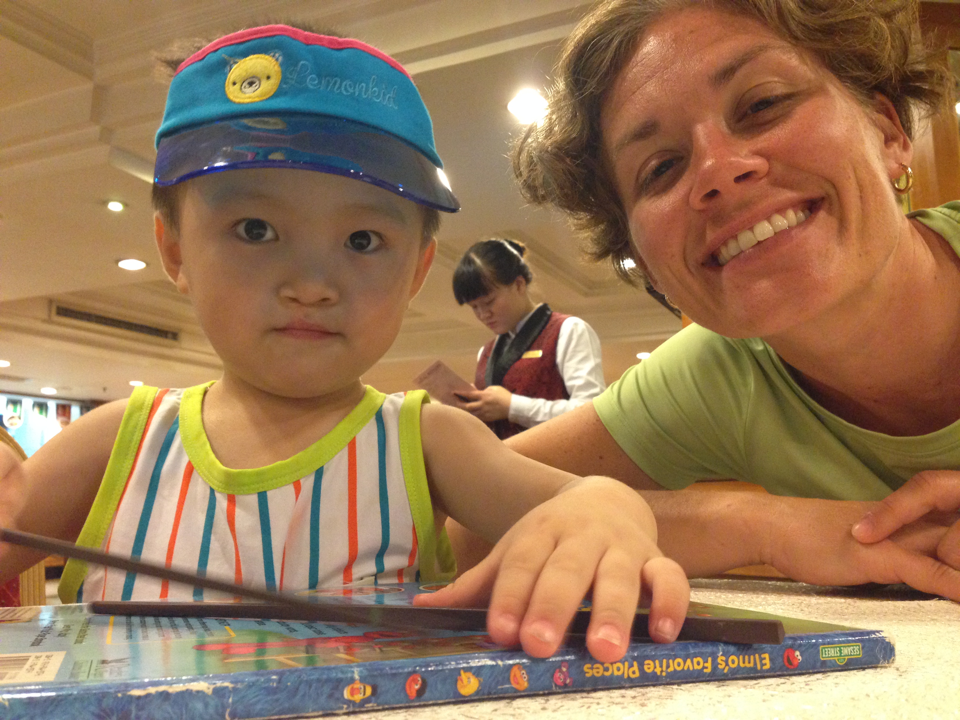 He doesn't eat with chopsticks yet. Local guides told me sometimes it takes until kids are 4-5 before they master them.