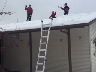 Since our garage damage from the summer storm has not yet been repaired, we have been advised to shovel off the heavy snow... but apparently its safe to walk up there... makes perfect sense to me!